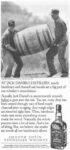 1989 At Jack Daniel's Distillery, sturdy barrelmen and charred oak barrels...